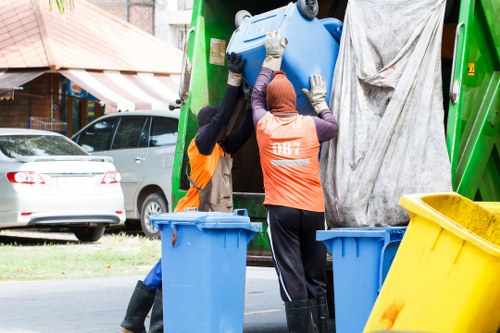 People disposing of old furniture responsibly in Purley